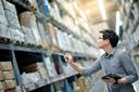 A person taking inventory of a warehouse.